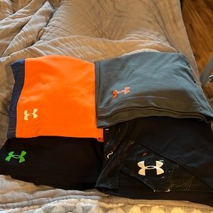 Boys (4) pairs of under armour shorts. (3) size 7 one size small.